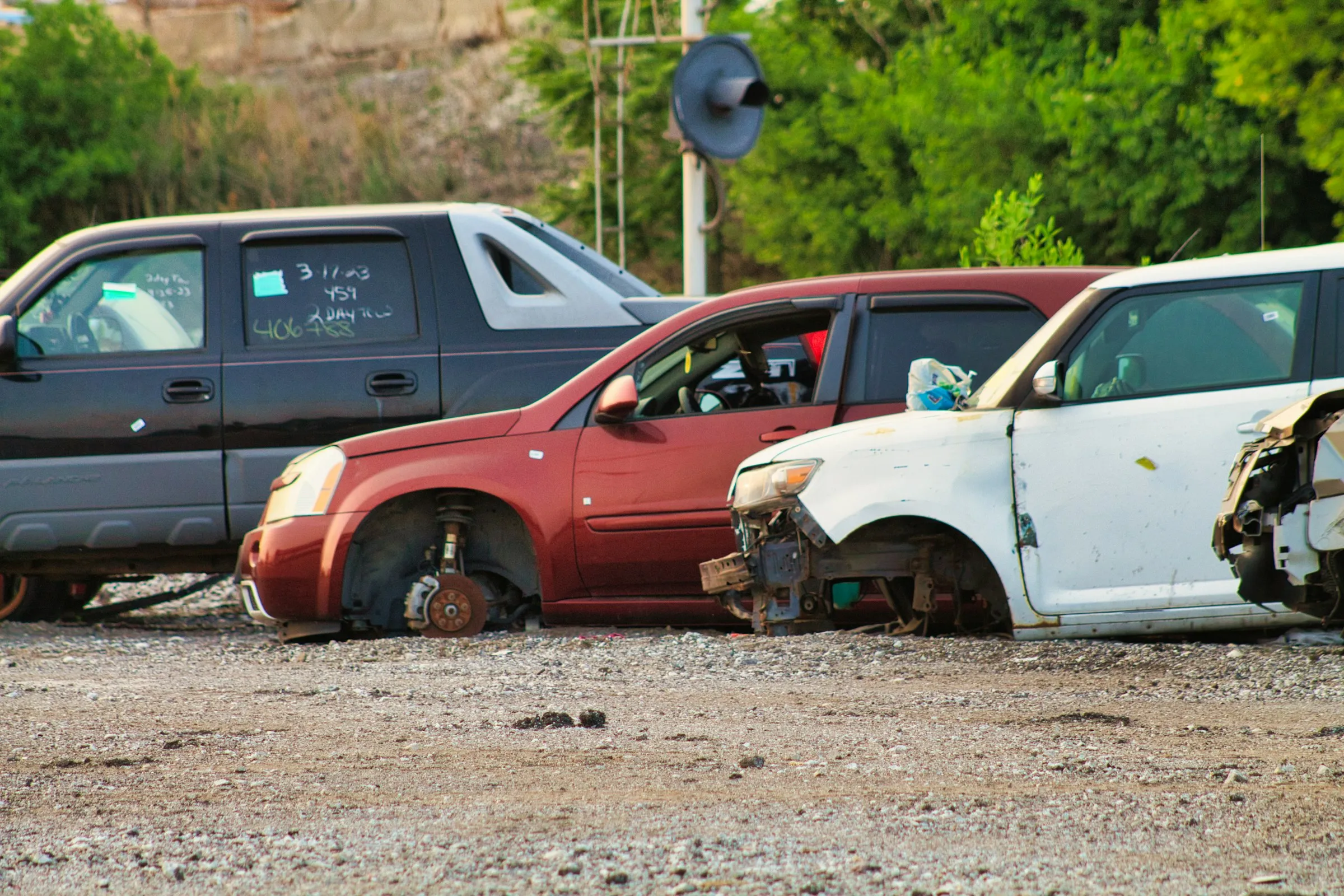 Junk cars waiting at a salvage yard